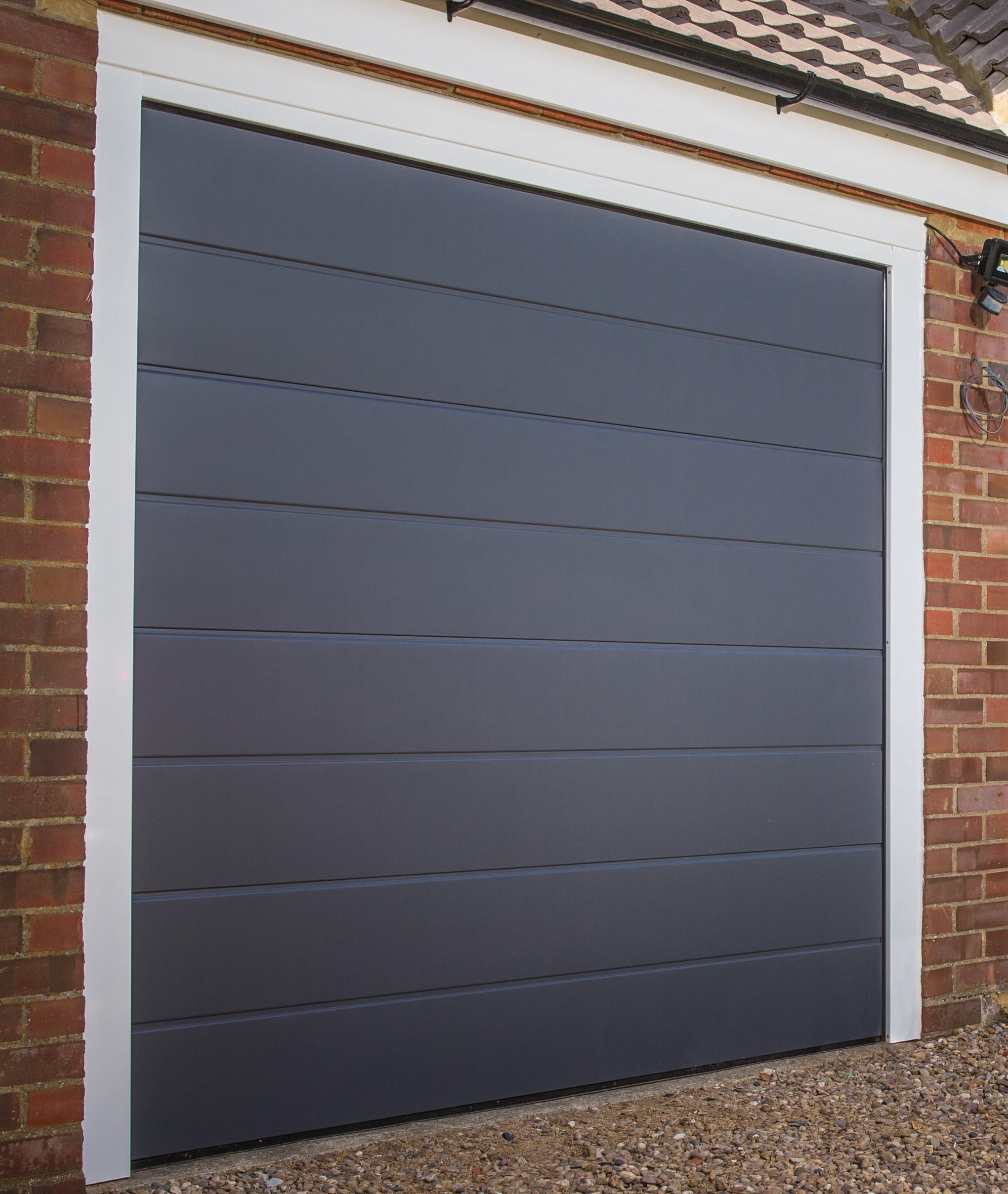 Apollo Garage Door technician performing installation in Dallas